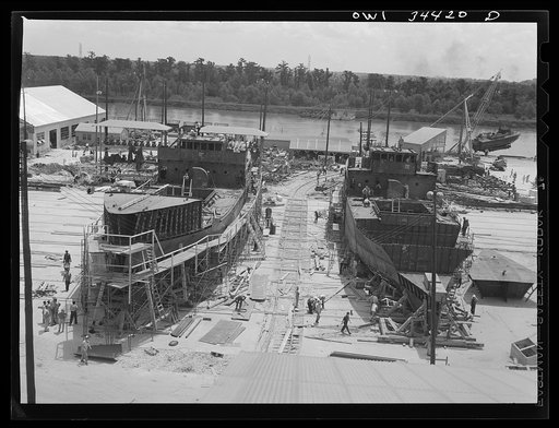 New Orleans, Louisiana. Cargo vessels under construction at the Higgins shipyards