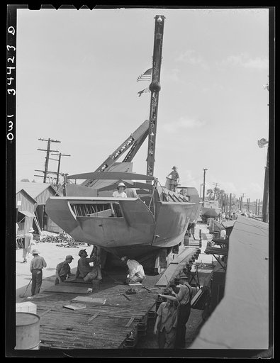 New Orleans, Louisiana. Ramp boats on railroad cars at the Higgins shipyards