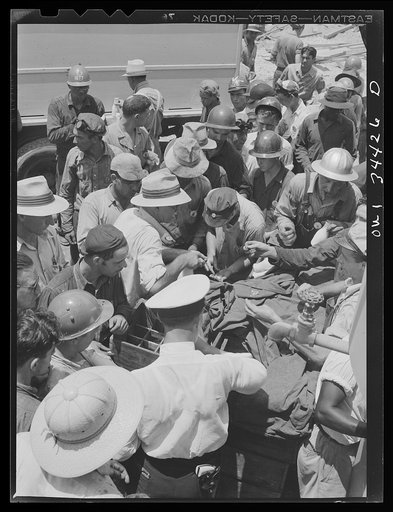 Untitled photo, possibly related to: New Orleans, Louisiana. Higgins shipyard workers buying milk at lunch hour