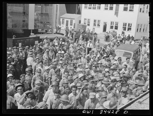 New Orleans, Louisiana. Workers leaving the Higgins shipyard at four pm