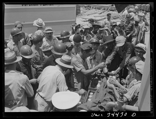 New Orleans, Louisiana. Higgins shipyard workers buying milk at lunch hour