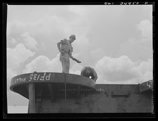 Welder and assistant at the Higgins shipyards. New Orleans, Louisiana