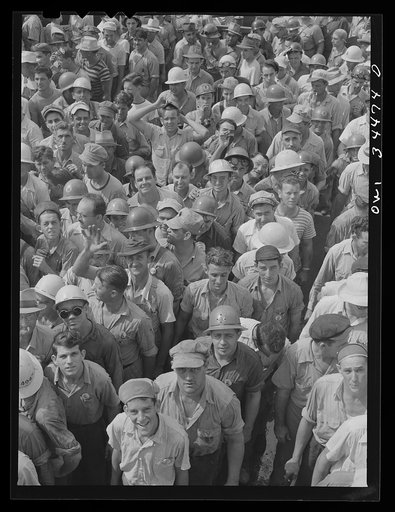 New Orleans, Louisiana. Higgins shipyard workers leaving the plant at four pm