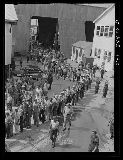 New Orleans, Louisiana. Higgins shipyard workers leaving the plant at four pm
