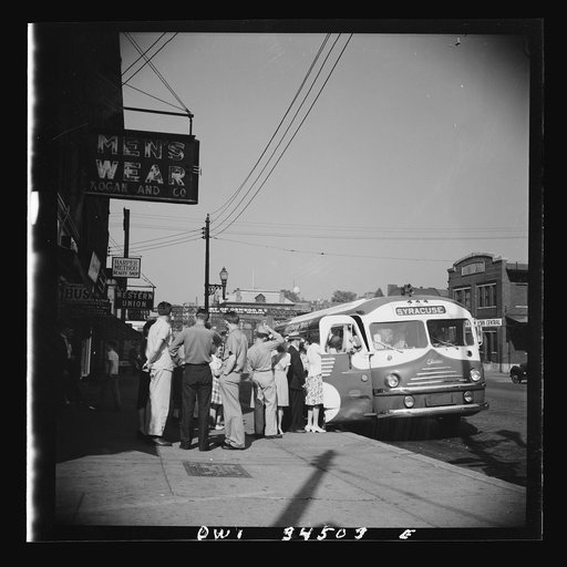 Untitled photo, possibly related to: Oswego, New York. Boarding a Syracuse bus on Bridge Street