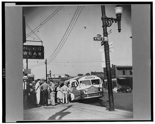 Oswego, New York. Boarding a Syracuse bus on Bridge Street