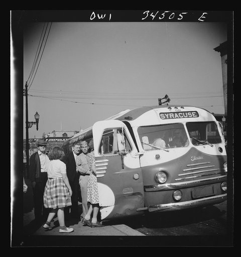 Untitled photo, possibly related to: Oswego, New York. Boarding a Syracuse bus on Bridge Street