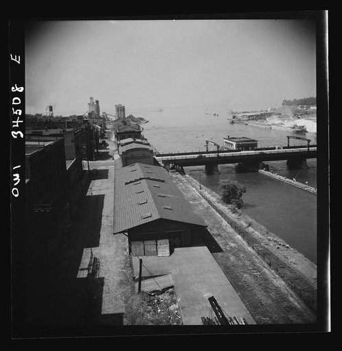 Oswego, New York. The waterfront looking toward Lake Ontario. A grain elevator is in the far left and the bauxite docks are at the far right