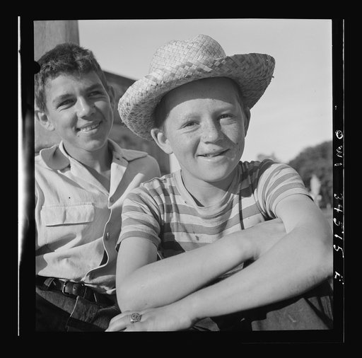 Oswego, New York. Boys recruited to work on the farms during the summer waiting to be picked up by the farmers at 7:30 a.m.