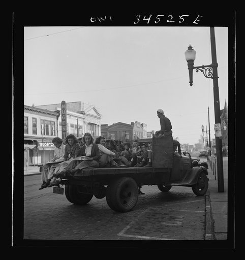 Untitled photo, possibly related to: Oswego, New York. Children, recruited for farm work during the summer, waiting to start for work outside the U.S. Employment Service