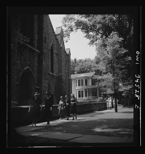 Oswego, New York. Oswegans leaving the Episcopal church on Sunday morning