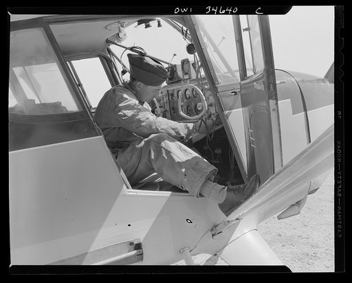 Bar Harbor, Maine. Ground crew working on a plane at the Civil Air Patrol base