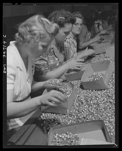 New Britain, Connecticut. Women in the Stanley plant inspecting bullet jackets for defective surfaces