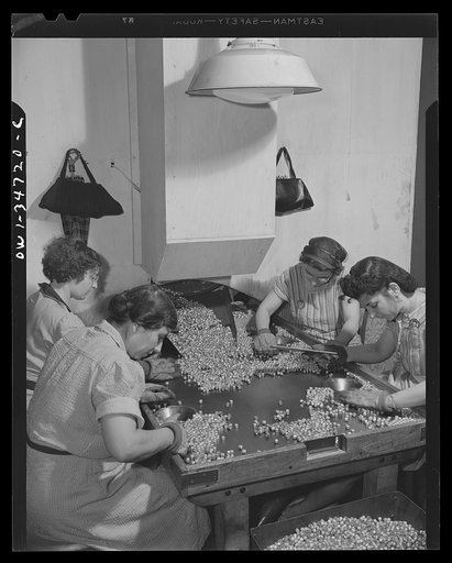 New Britain, Connecticut. Woman at the Stanley plant searching for defective bullet jackets