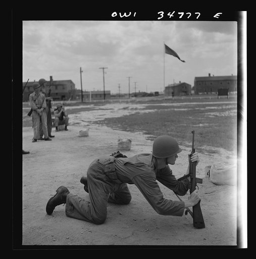 Warner Robins, Georgia. Air Service Command, Robins Field. Practicing change from a sitting to a prone position with the carbine
