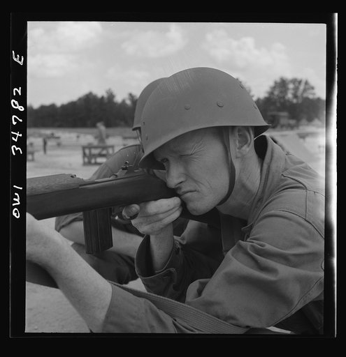 Warner Robins, Georgia. Air Service Command, Robins Field. Private Walter F. Guthrie learning marksmanship with a carbine. In civilian life he was a gas station operator in Canadian, Texas