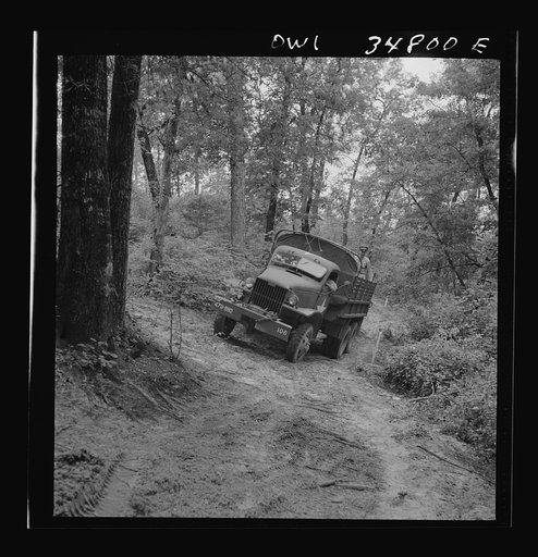 Untitled photo, possibly related to: Warner Robins, Georgia. Air Service Command, Robins Field. Part of the training of the truck drivers of the depot group consists of driving many times through an obstacle course in the woods
