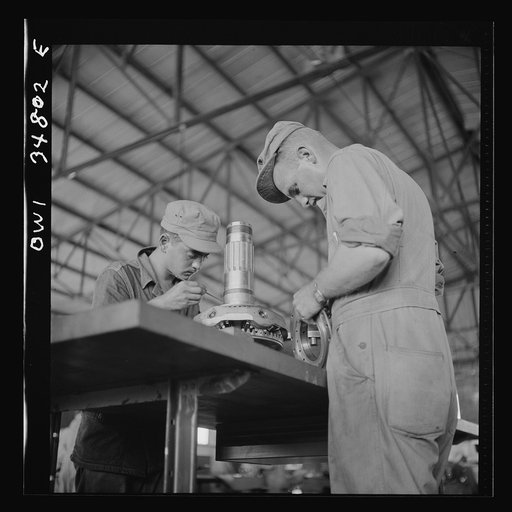 Warner Robins, Georgia. Air Service Command, Robins Field. Assembling the nose section of a Pratt and Whitney engine
