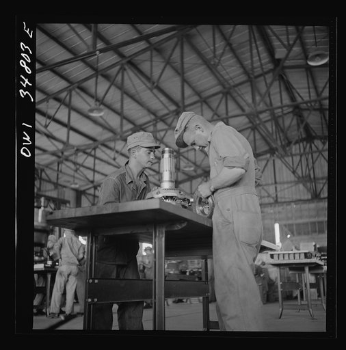 Warner Robins, Georgia. Air Service Command, Robins Field. Assembling the nose section of a Pratt and Whitney engine