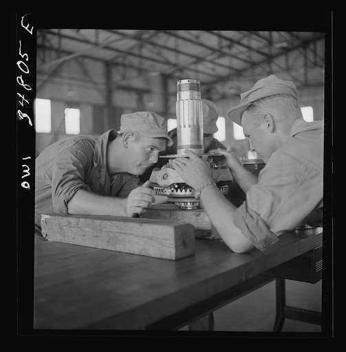 Warner Robins, Georgia. Air Service Command, Robins Field. Assembling the nose of a Pratt and Whitney engine