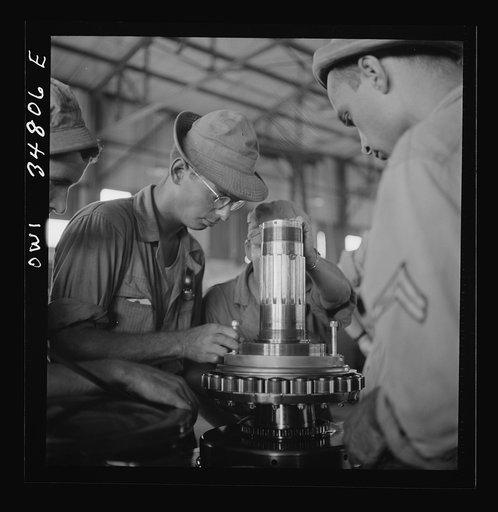 Untitled photo, possibly related to: Warner Robins, Georgia. Air Service Command, Robins Field. Assembling the nose of a Pratt and Whitney engine