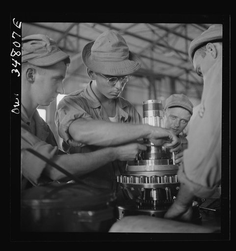 Warner Robins, Georgia. Air Service Command, Robins Field. Assembling the nose section of a Pratt and Whitney engine