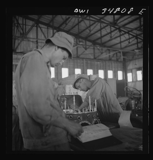 Untitled photo, possibly related to: Warner Robins, Georgia. Air Service Command, Robins Field. Assembling the nose of a Pratt and Whitney engine