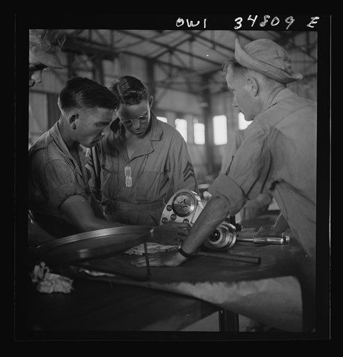 Untitled photo, possibly related to: Warner Robins, Georgia. Air Service Command, Robins Field. Assembling the nose of a Pratt and Whitney engine