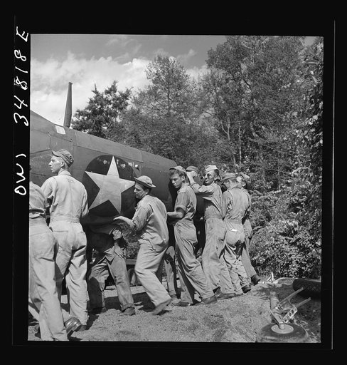Warner Robins, Georgia. Air Service Command, Robins Field. Practicing picking up and loading of an old P-39 with a C3 truck and trailer