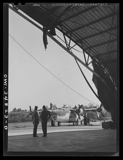 Warner Robins, Georgia. Air Service Command, Robins Field. A B-24 Liberator bomber being serviced at an air depot group hangar