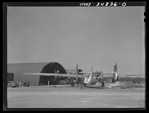 Warner Robins, Georgia. Air Service Command, Robins Field. A B-24 Liberator bomber being serviced at a hangar of an air depot group