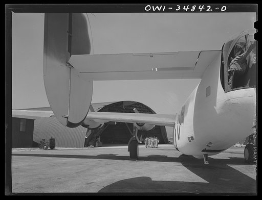 Warner Robins, Georgia. Air Service Command, Robins Field. A crew of men coming out to work on a B-24 Liberator bomber at Robins Field