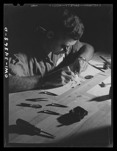 Untitled photo, possibly related to: Warner Robins, Georgia. Air Service Command, Robins Field. Staff Sergeant C.A. Jones, an instrument repair man, working on an aircraft clock. Sergeant Jones comes from Lloyd, Florida