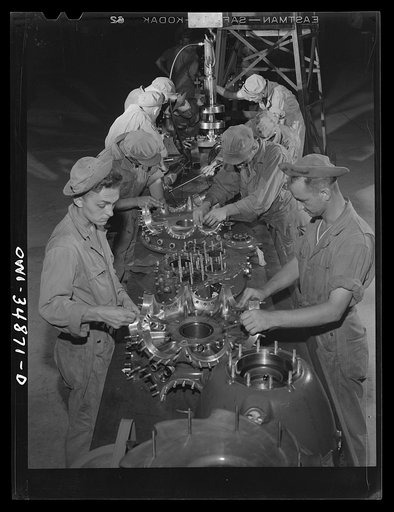 Warner Robins, Georgia. Air Service Command, Robins Field. Men of the engine squadron of an air depot group disassembling and cleaning 2000 horsepower Pratt and Whitney engines