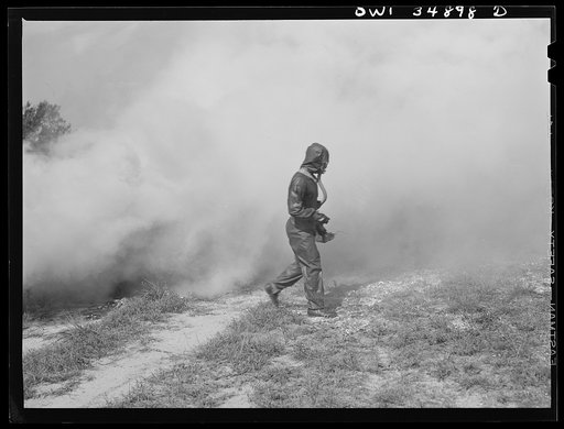 Untitled photo, possibly related to: Daniel Field, Georgia. Air Service Command. Men of a chemical unit demonstrating the method of decontaminating a gassed area