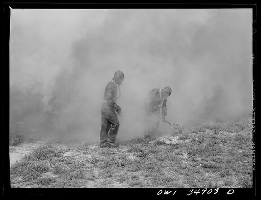 Daniel Field, Georgia. Air Service Command. Men of a chemical unit demonstrating the method of decontaminating a gassed area