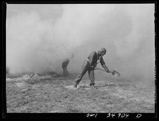 Untitled photo, possibly related to: Daniel Field, Georgia. Air Service Command. Men of a chemical unit demonstrating the method of decontaminating a gassed area