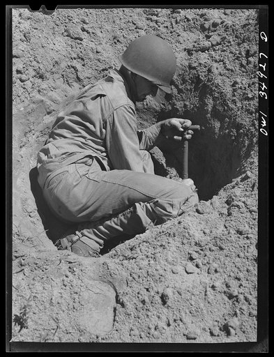 Untitled photo, possibly related to: Daniel Field, Georgia. Air Service Command. Learning to dig a foxhole in a hurry