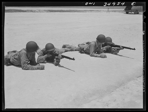 Untitled photo, possibly related to: Daniel Field, Georgia. Air Service Command. Learning to fire a Thompson submachine gun from a sitting position