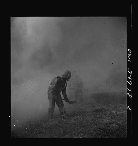 Untitled photo, possibly related to: Daniel Field, Georgia. Air Service Command. Men of a chemical unit demonstrating the method of decontaminating a gassed area