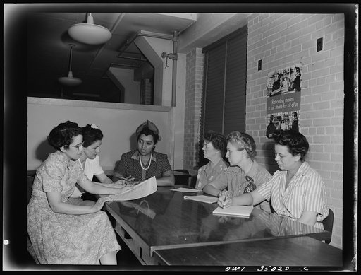 Newport News, Virginia. Mrs. Ethel R. Stephens, organizer of the Consumer Interest Council, a group of Negro housewives at Newport News, making a report to the members of the Special Services Section of the Office of Price Administration, concerning point rationing. Left to right: Mrs. M. Barr, Miss