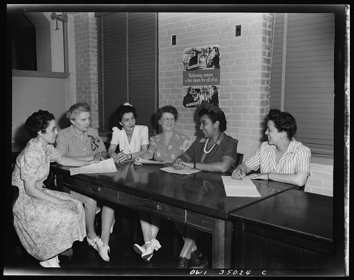 Newport News, Virginia. Mrs. Ethel R. Stephens, organizer of the Consumer Interest Council, a group of Negro housewives at Newport News, making a report to the members of the Special Services Section of the Office of Price Administration, concerning point rationing. Left to right: Mrs. M. Barr, Miss