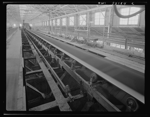 A conveyor belt which carried fine copper ore and discharges it into bins at one of the concentrators of the Utah Copper Company at Magna and Arthur in Utah