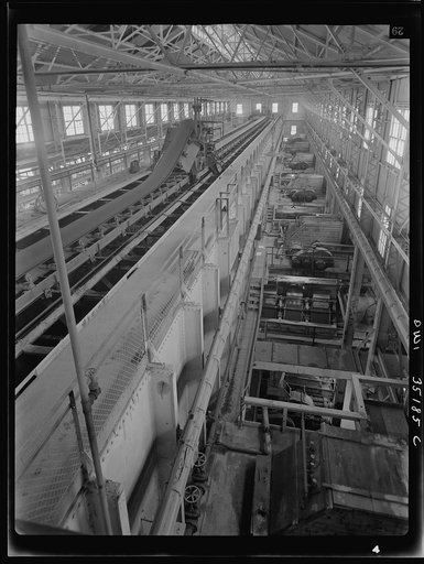 Untitled photo, possibly related to: A conveyor belt which carried fine copper ore and discharges it into bins at one of the concentrators of the Utah Copper Company at Magna and Arthur in Utah