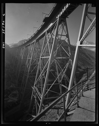 Bingham Copper Mine, Utah. Main assembly yards, office, shops, air compressor and waste material dumps up above as seen across main from "H" East side
