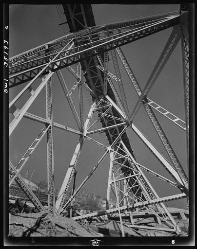 Untitled photo, possibly related to: Bingham Copper Mine, Utah. Main assembly yards, office, shops, air compressor and waste material dumps up above as seen across main from "H" East side