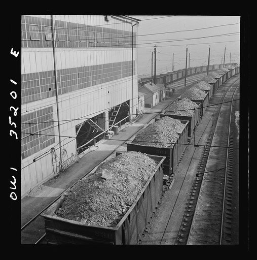 Trains of ore containing copper arriving at one of the large refining plants of the Utah Copper Company