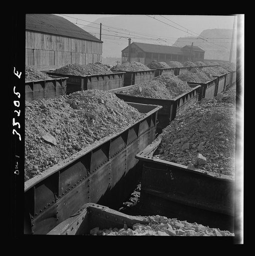 Untitled photo, possibly related to: Trains of ore containing copper arriving at one of the large refining plants of the Utah Copper Company