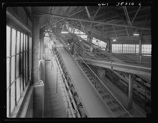 A conveyor belt which carries fine copper ore and discharges it into bins at one of the concentrators of the Utah Copper Company at Magna and Arthur in Utah