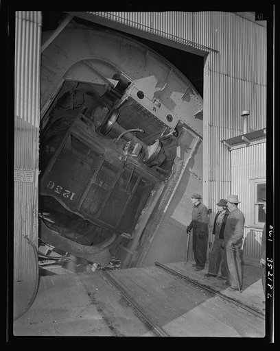Magna, Utah. A rotary car dumper discharging copper ore at the mill